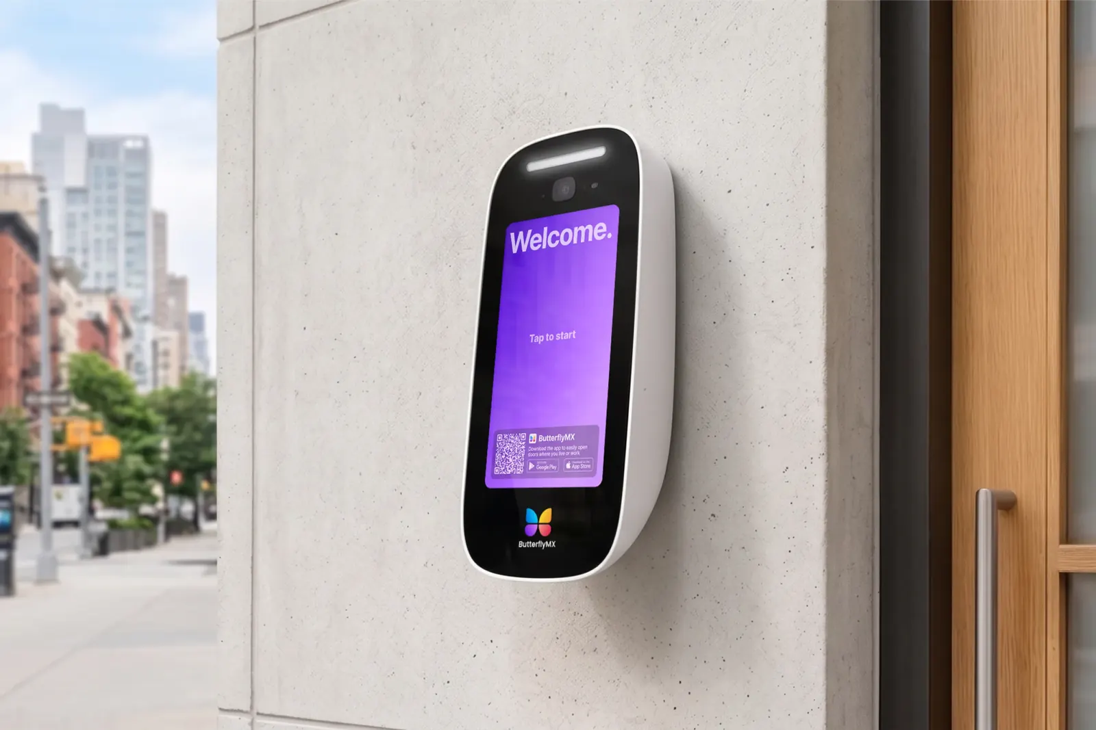 ButterflyMX 8-inch surface-mount video intercom beside a building entrance