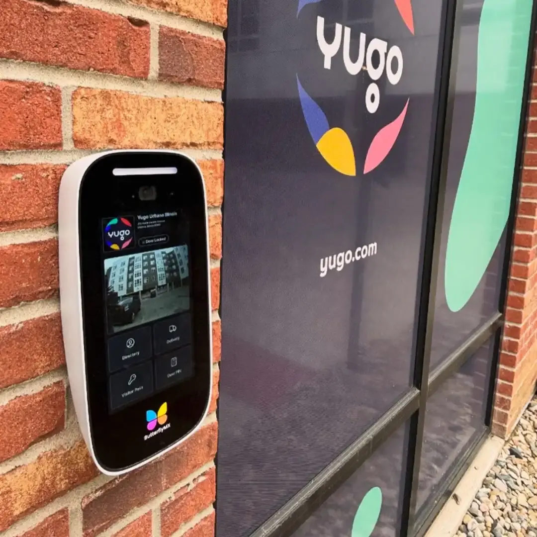 ButterflyMX intercom installed on a brick building entrance