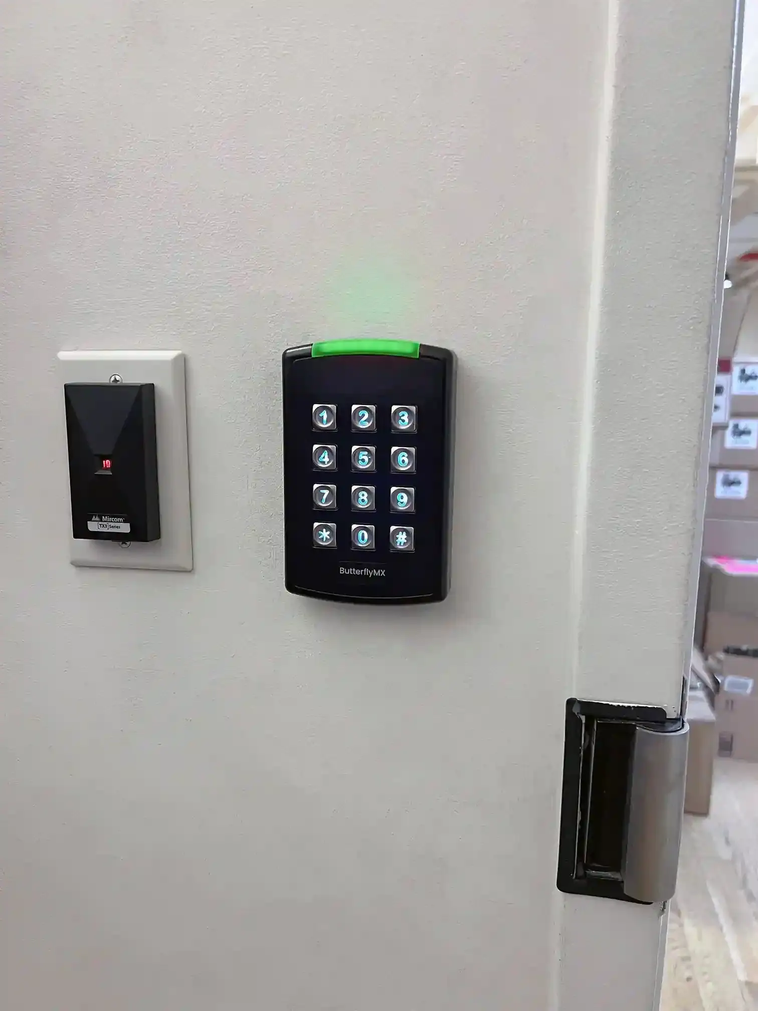 ButterflyMX keypad and card reader beside a door